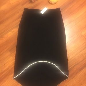 Black skirt with diamond accents.